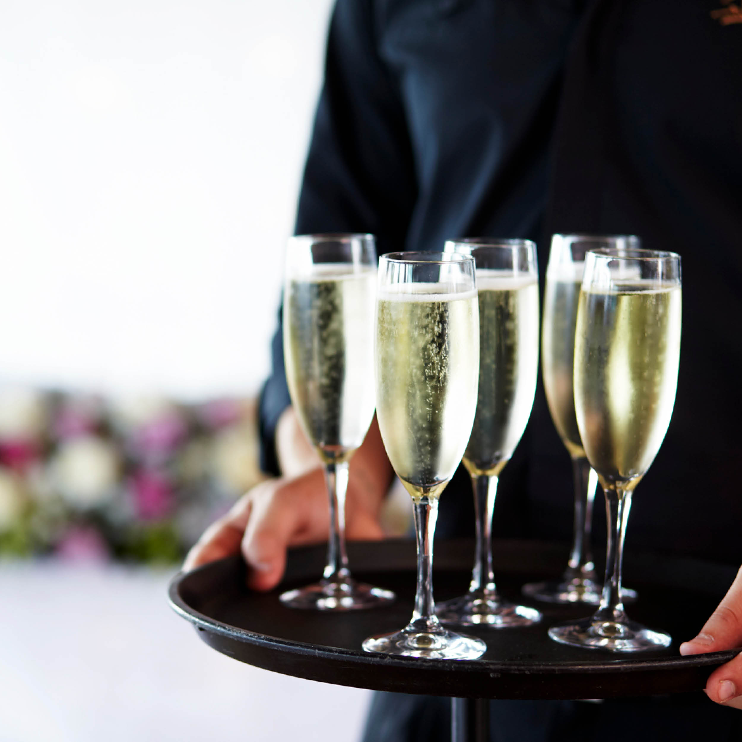 Tray of sparkling wine being held by Function staff